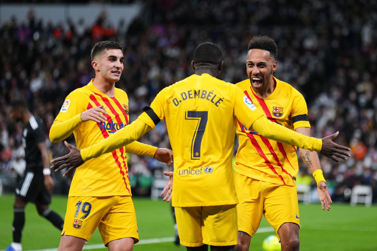 Barcelona players celebrating after scoring a goal